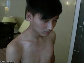Young Asian men clean up after a round of masturbation with cum