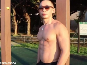 Sculpted physique on full display in outdoor workout and pose session