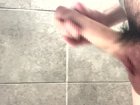 Young Japanese man pleasuring his well-endowed body